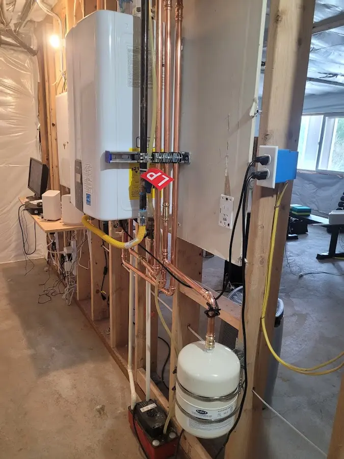 Licensed plumber repairing a kitchen sink in Hamlin
